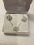 famous shape 3 piece set with pierced earings and 16" long pendant done in top quality CZs and sterling