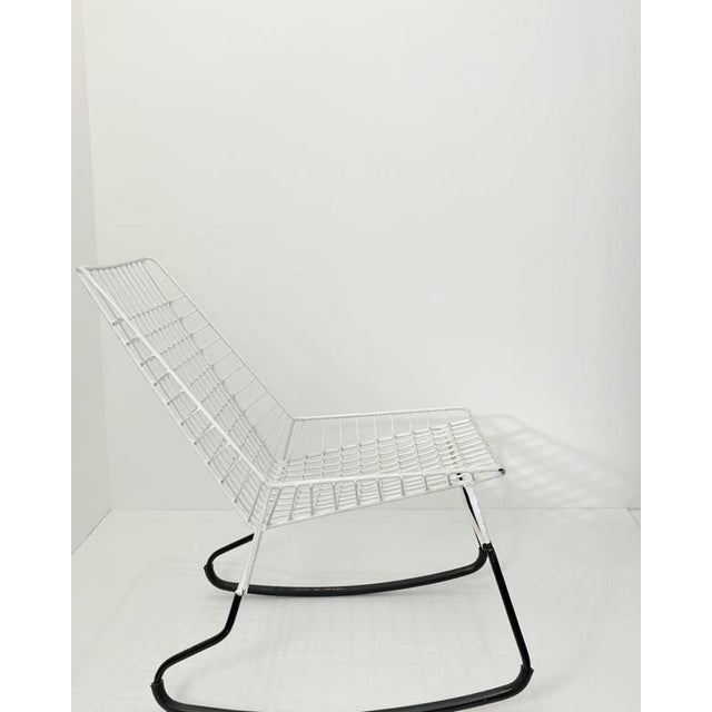 The Flamingo rocking chair is a distinctive design by Cees Braakman for Pastoe. with its elegant wire construction, white...