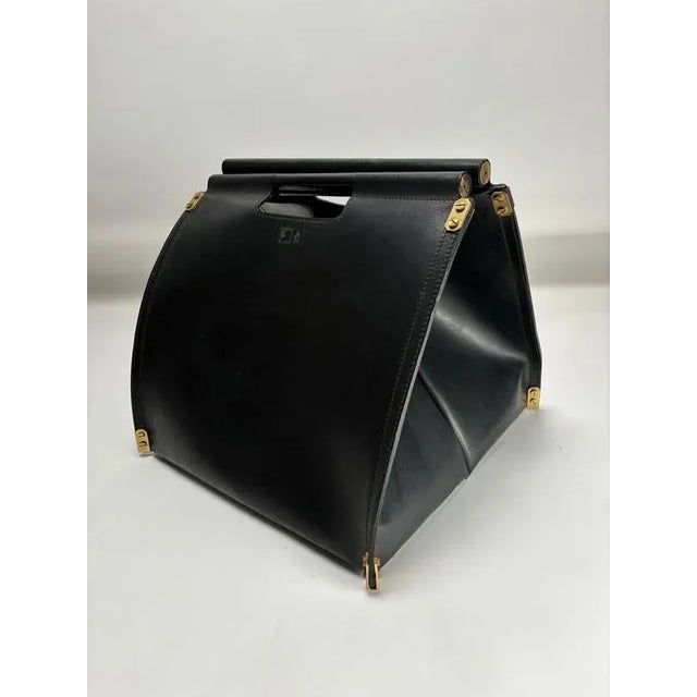 The high-quality leather and gold-plated brass bag is an elegant log holder (or firewood sack) designed by Italian...