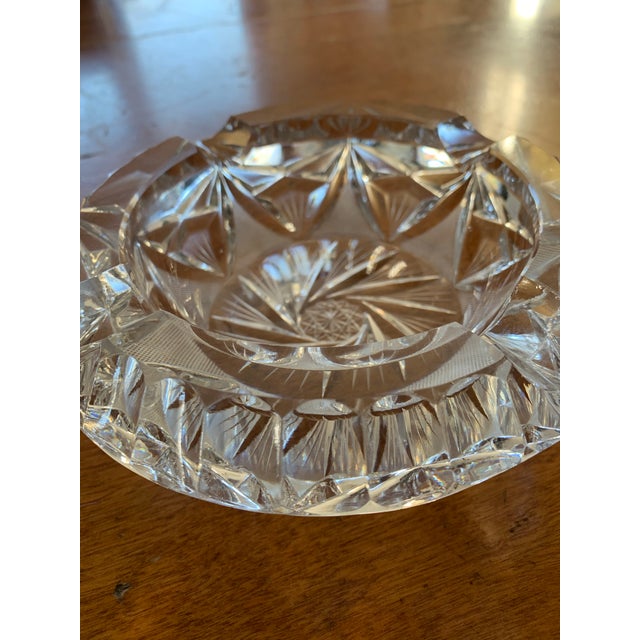Vintage crystal ashtray with starburst design. 6 inches wide with opening of 4 inches. Suitable for cigars.