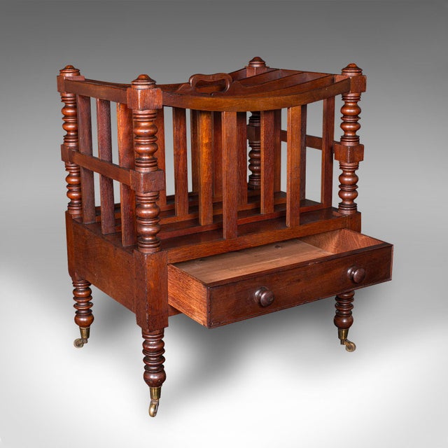 This is an antique 4 division Canterbury. An English, mahogany broadsheet newspaper or magazine stand, dating to the...