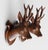 A charming petite pair of antique Black Forest carved deer head trophy plaques, circa 1900. These handsome plaques are...