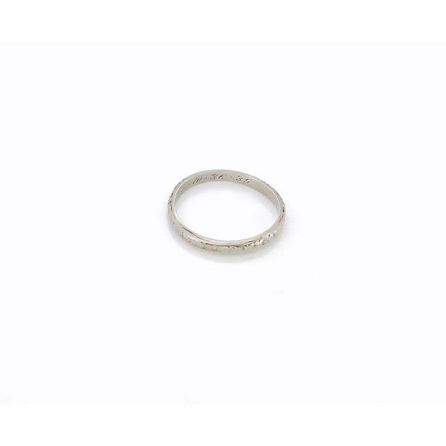 About This Ring: Add a touch of vintage elegance to your jewelry collection with this Vintage Belais floral eternity band....