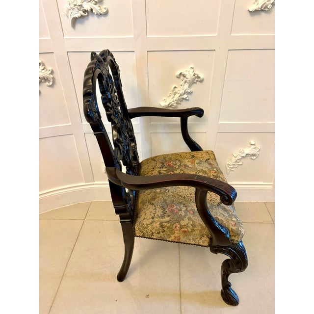 An exceptional Victorian carved mahogany desk chair in the Chippendale style of outstanding quality and richly detailed...