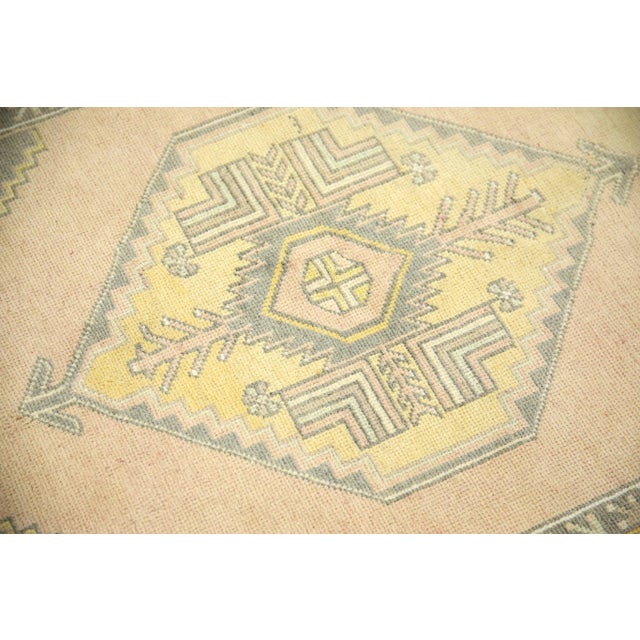 Introducing a one-of-a-kind vintage Turkish hand-knotted wool rug, carefully crafted by skilled artisans using traditional...