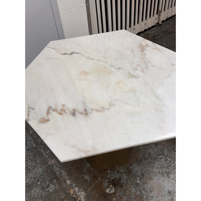 Design Plus Gallery presents the Demetria Dining Table by Noir. The geometric design pairs a hexagonal slab of Bianco...