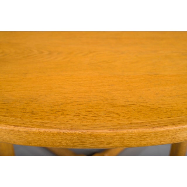 Elegant extendable dining table in solid oak designed by Kurt Østervig for Jason Møbler, Denmark, 1950s. Featuring a...