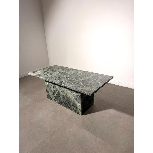 Striking vintage coffee table crafted entirely from richly patterned green marble , dating from circa the 1970s. The...