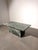 Striking vintage coffee table crafted entirely from richly patterned green marble , dating from circa the 1970s. The...