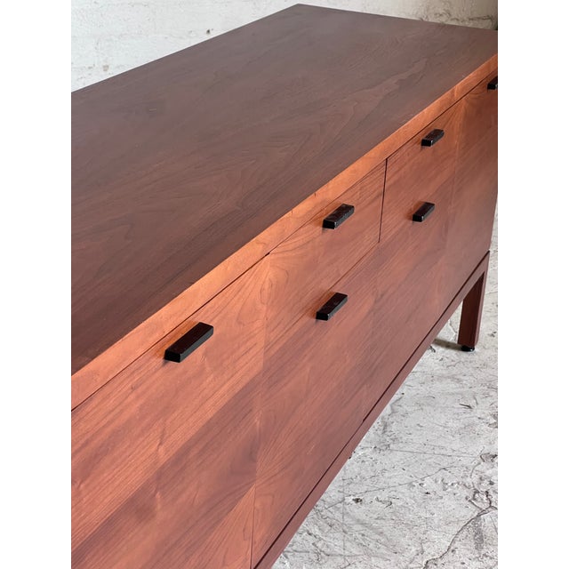 Newly restored mid century walnut credenza, featuring beautiful walnut grain and combination storage capabilities of small...