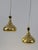 Set of two lovely and highly decorative mid-century modern perforated brass pendant lamps or hanging lights. Designed by...