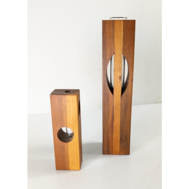We are selling this pair of simple wood Mid-Century Modern bud vases. These vases have simple form and construction with...