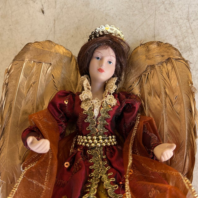 Large Angel Topper with Porcelain face and hands. Enhance your holiday décor with the elegance of this angel tree topper....