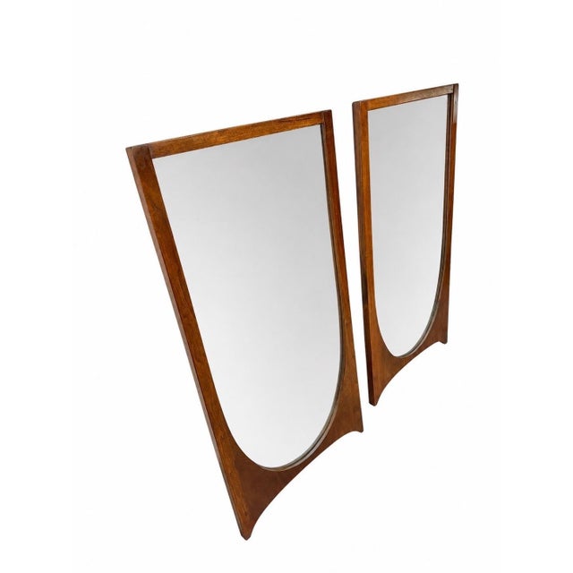 Enhance your space with this stunning pair of Mid-Century Modern Broyhill Brasilia walnut mirrors, one of the most...