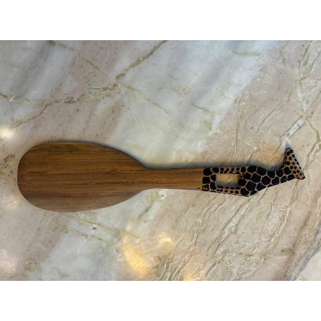 This is a hand carved wooden salad serving set consisting of a fork and spoon. They are typically made by craftsmen in...