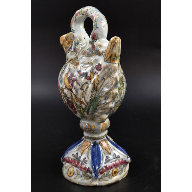 An 18th-century Italian polychrome majolica pilgrim flask, or fiasca da pellegrino, made in tin-glazed earthenware. The...