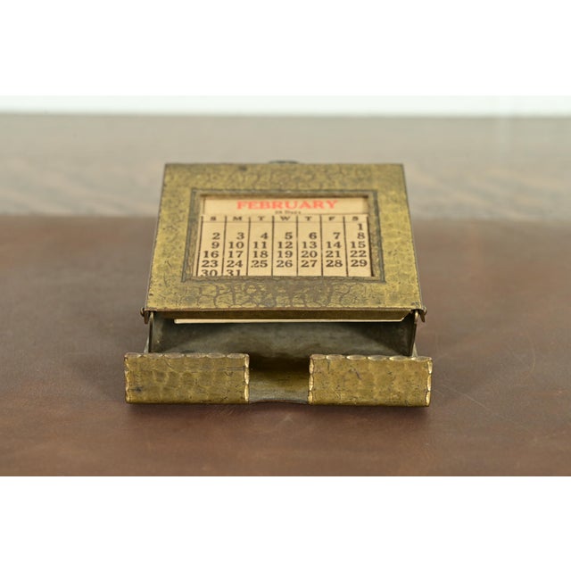 A gorgeous Arts & Crafts period brass finished hand hammered copper perpetual desk calendar frame or picture frame with...