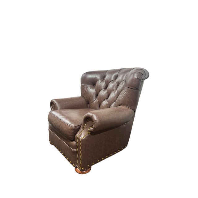 A very nice, tufted leather, lounge chair produced by Distinction Leather, Inc. (Hanover NC). The chair boasts rolled...