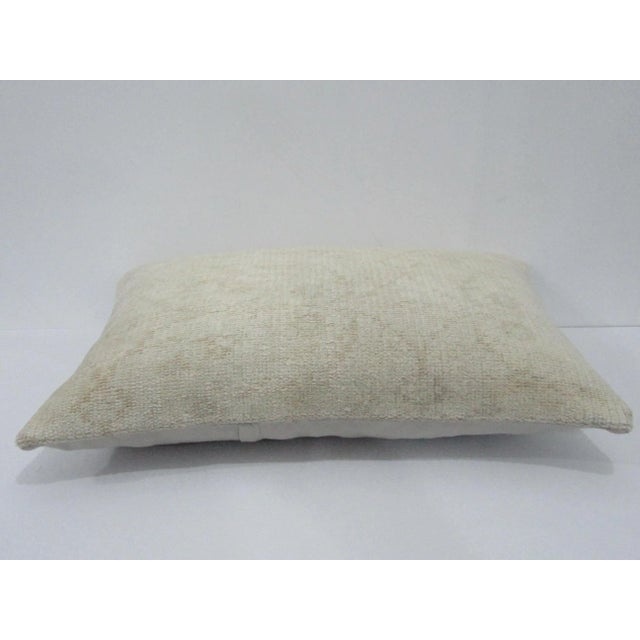 Decorative pillow cover made from a vintage Turkish handknotted rug. Backed with good quality cotton fabric. Pillow...
