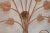3-panel fireplace screen detailed with the silhouette of a bouquet of vines of rose flower. Subtle muted red-brown color....