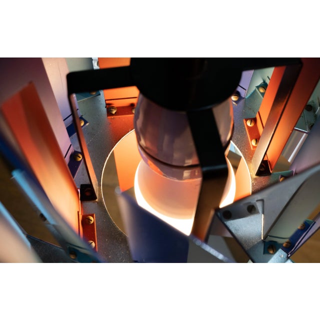 This colourful Danish pendant lamp was originally designed in 1962 by Simon Henningsen (1920-1974) for the Divan 2...