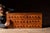 c. 1900s-1910s; A. N. Russell & Sons - Ilion, NY Large oak cabinet fitted with three horizontal rows of narrow drawers,...