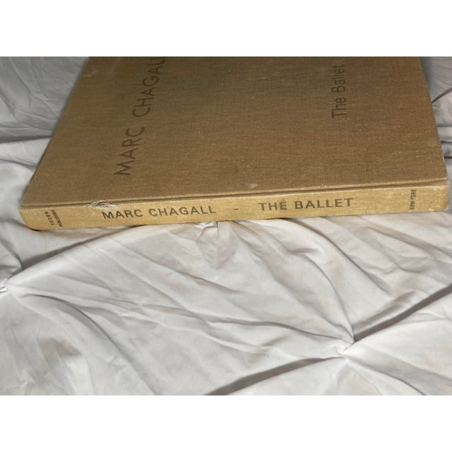 A stunning book with incredibly colorful prints inside. Many people take apart to frame the art although best to leave as...
