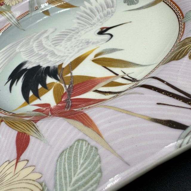 This is a Spode Japanese Heron pentagonal accent plate featuring a detailed central heron design surrounded by floral motifs.