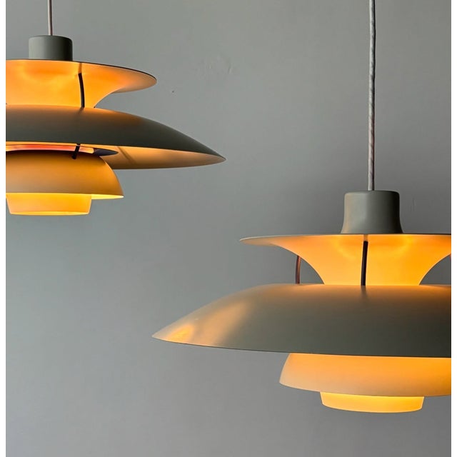 The ph5, designed by poulsen henningsen, blends beautifully with designs by eames, knoll, the saarinen tulip chairs, usm,...
