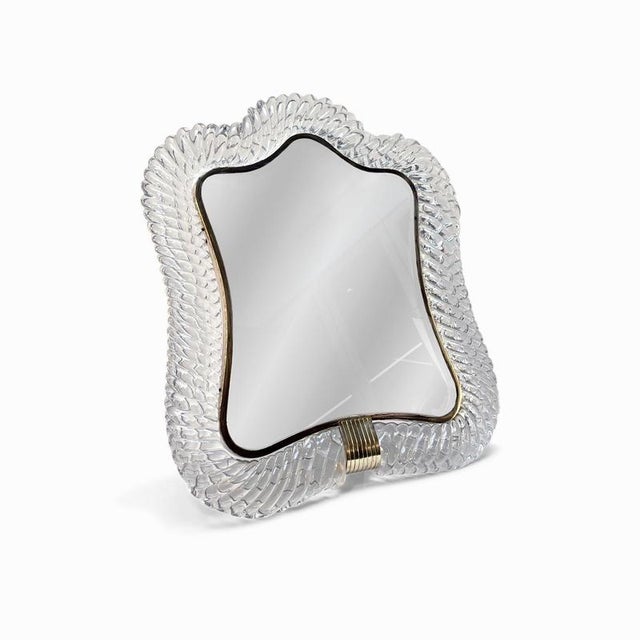 A rare tabletop mirror by Barovier & Toso, Murano, produced in the 1940s. The frame is formed from thick, hand-blown...