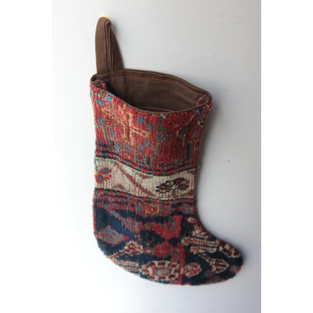 Here i am listing a one of kind Decorative Stocking made from 100% Handmade double knotted antique tribal rug. It has been...
