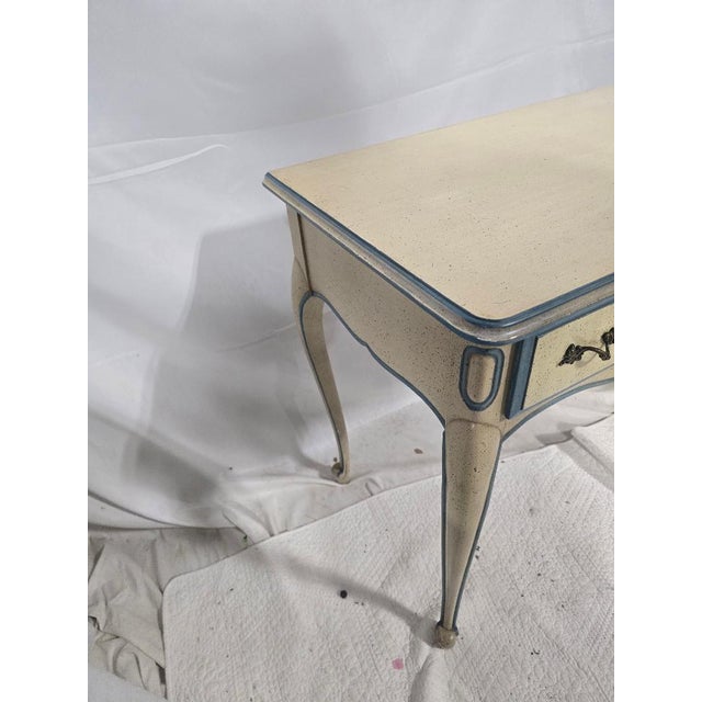 Elegant vintage French Provincial style writing desk featuring a cream painted finish with blue trim, cabriole legs,...