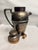 This is Bernard Rice's Sons Apollo EPNS hammered silver-plated cocktail shaker features a classic Art Deco design....