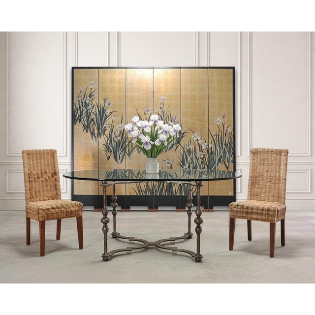 A rich and dramatic 20th century Chinese Export folding six-panel double-sided coromandel screen executed in radiant gilt,...