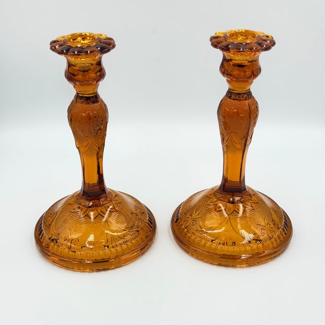 Timeless elegance of this stunning vintage Indiana Glass Tiara Amber Sandwich pattern candlesticks! This exquisite set...
