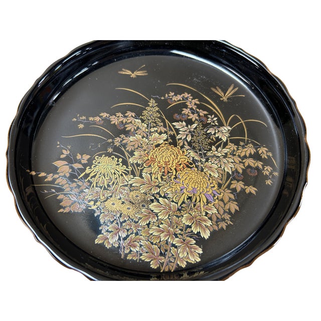 This elegant Shibata Japanese porcelain plate features a striking scalloped rim and a deep, glossy black glaze that serves...