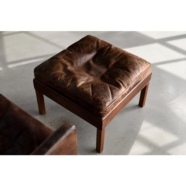 The icon of danish modernism, this rare set includes the elegant model 2207 armchair and footstool. The armchair was...