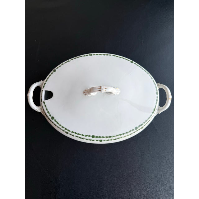 This antique oval tureen and lid set from L Straus & Sons marked 1844 features a green floral pattern. Rare pattern and...