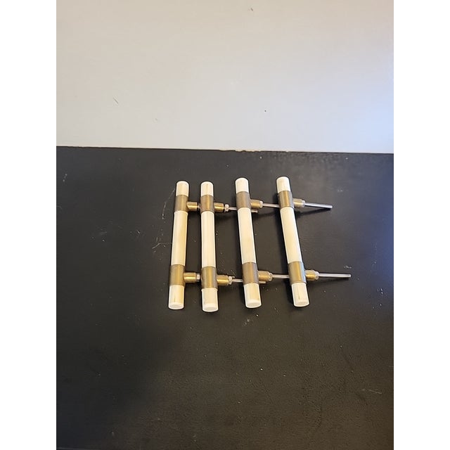 Beautiful white quartz and brass drawer pulls. Hardware is attached.