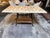 Design Plus Gallery presents an Indoor/Outdoor Dining Table with Marble Top and Wrought Iron Base. The table has a cream...