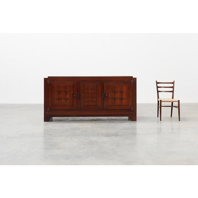 A superb example of Charles Dudouyt’s sculptural Art Deco vocabulary, this oak sideboard from circa 1940 showcases the...