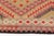 This is a vintage Turkish Oushak rug from the Mid 20th Century. The piece was hand-knotted.