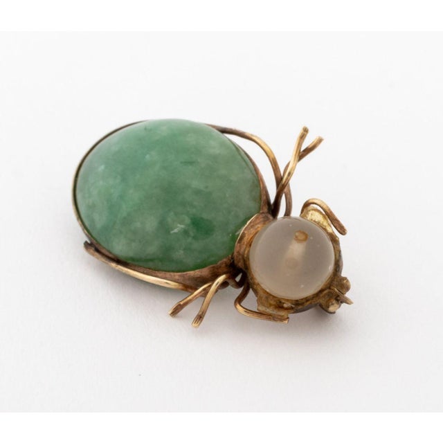 10K Yellow Gold Jade Quartz Insect Brooch, featuring one bezel set jade oval cabochon weighing approx. 16.00 carats,...