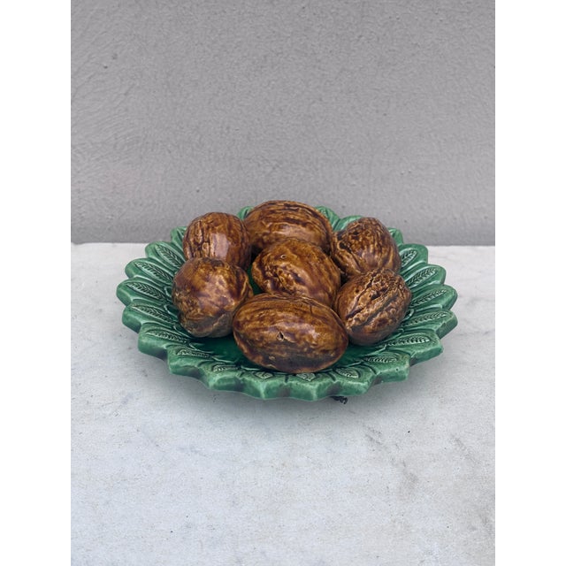 Portuguese Majolica Palissy Walnuts Platter signed Aires Constantino Leal Caldas Da Rainha. Circa 1940. 5.5 inches diameter.
