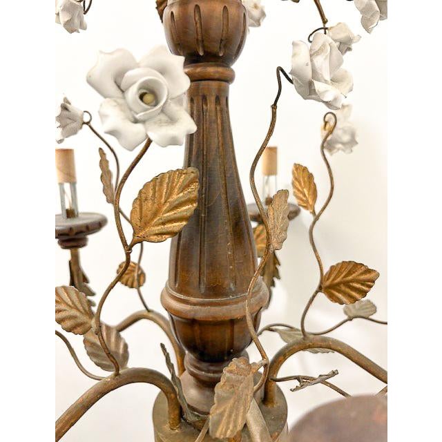This exquisite wooden tole chandelier features five scrolling arms, each accented with porcelain roses that add a touch of...