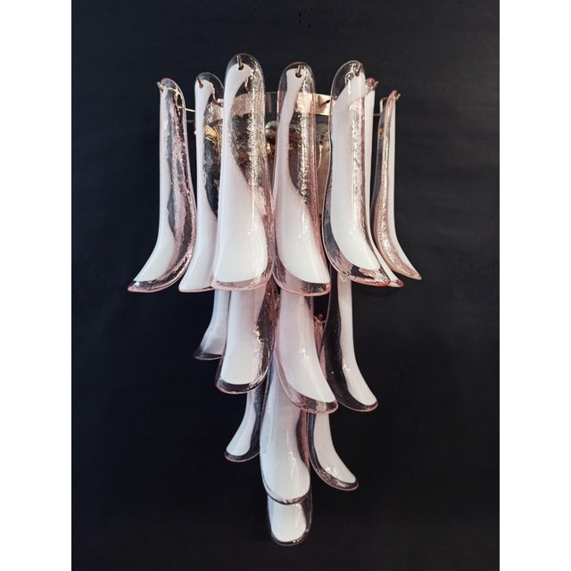 Pair of Vintage Italian Murano wall sconces. Wall lights have 16 pink and white“lattimo” glasses (for each applique) in a...