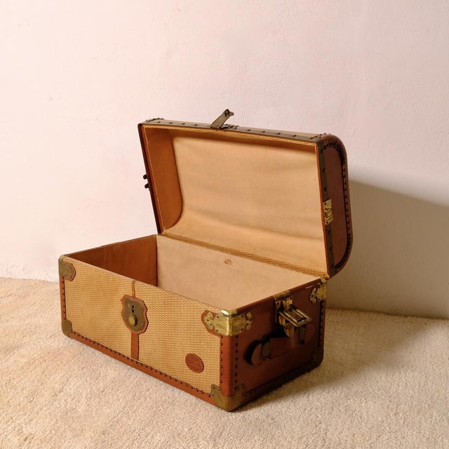 A vintage Bocci travel trunk, a highly prized piece of furniture and collectibles for its historic charm. Made of wood and...