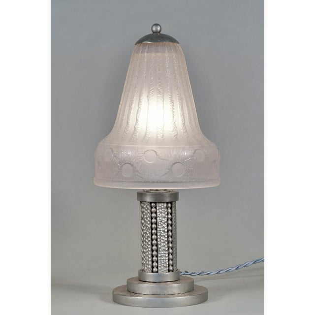 H. Fournet & Daum A wonderful very rare French 1930 art deco lamp in nickel plated wrought iron. The forged base was made...