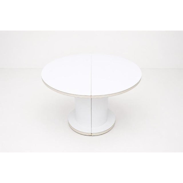 This vintage extendable round dining table by Lasko exemplifies the bold, geometric forms characteristic of 1970s design....