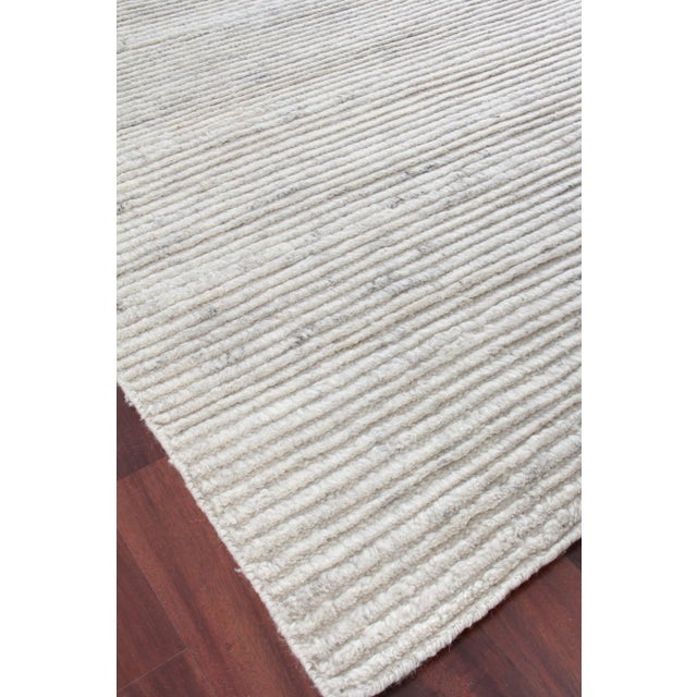 The subtle variations in color of the Hamilton rug give enough interest in design while still reading as a neutral. Hand-...